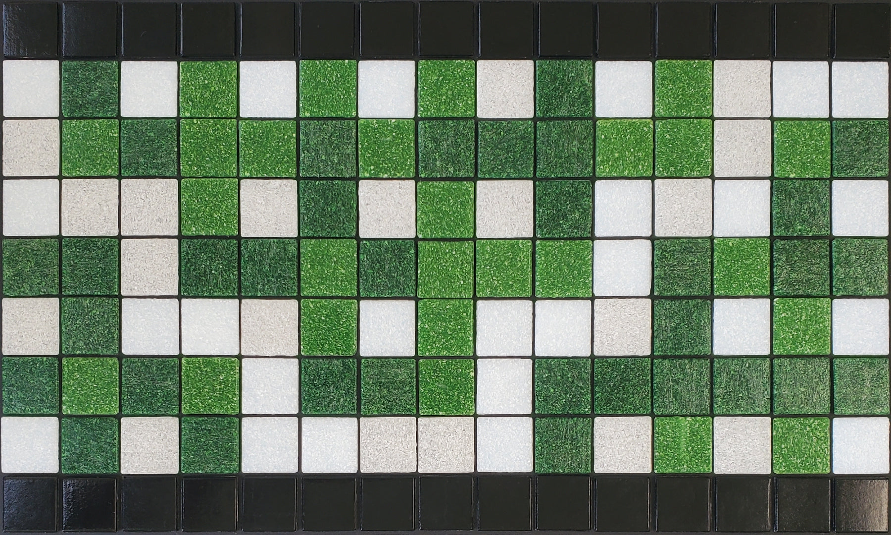Alma  B - botanical glass mosaic waterline pool border tile - glossy black, green and white in a garden trellis pattern. 