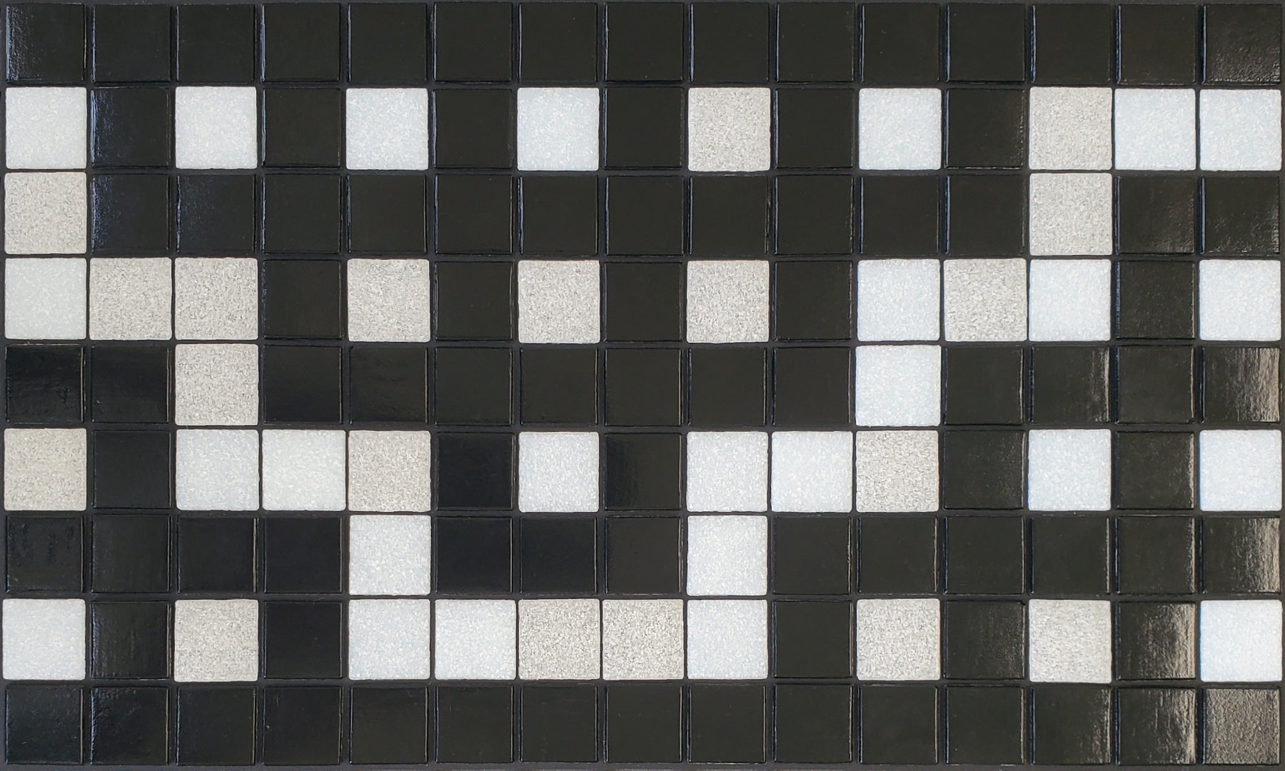 Alma  E - botanical glass mosaic waterline pool border tile - glossy black and white in a garden trellis pattern. 