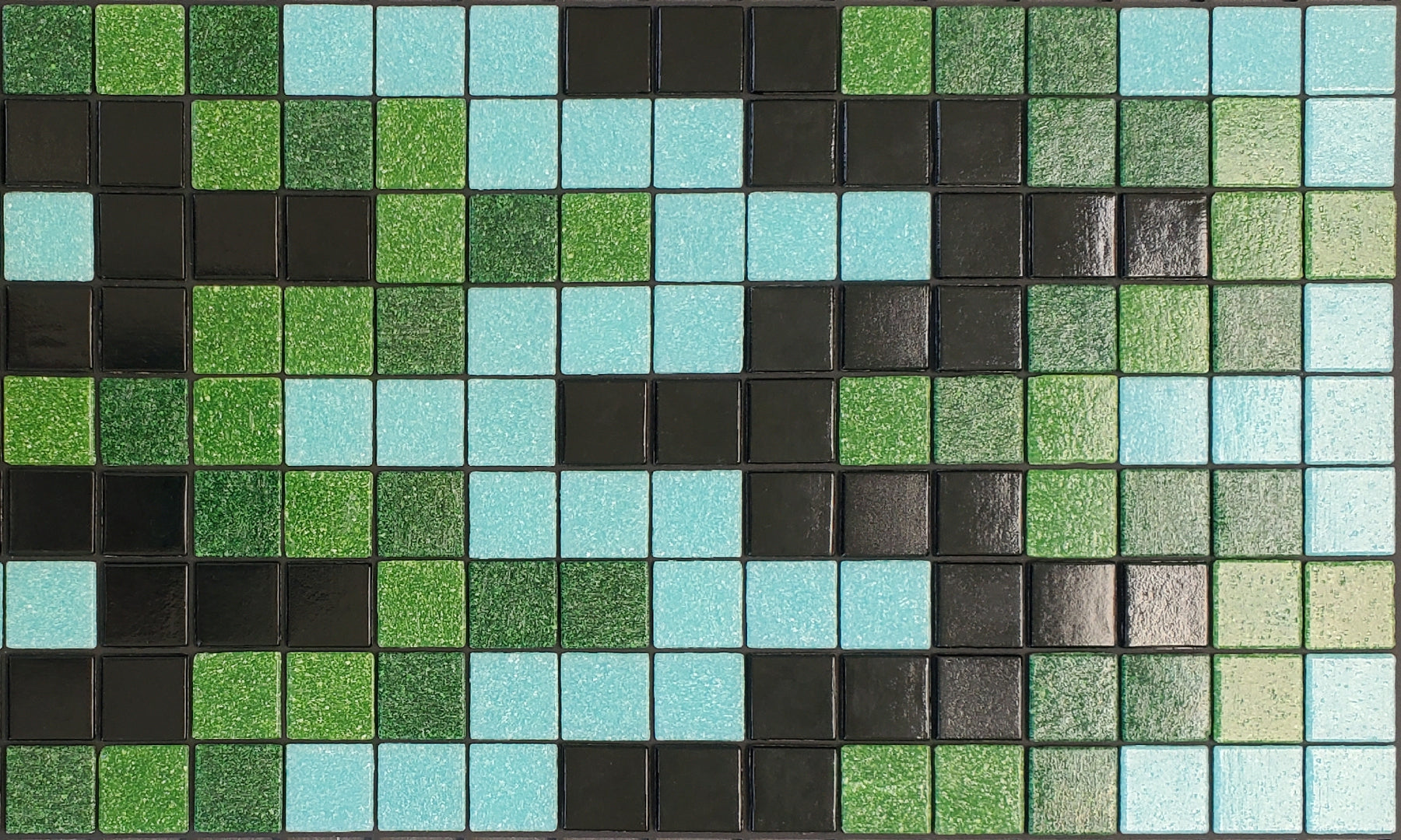 Bargello N - glass mosaic waterline pool border tile - glossy black, light blue and green in a rhythmic, undulating pattern. 