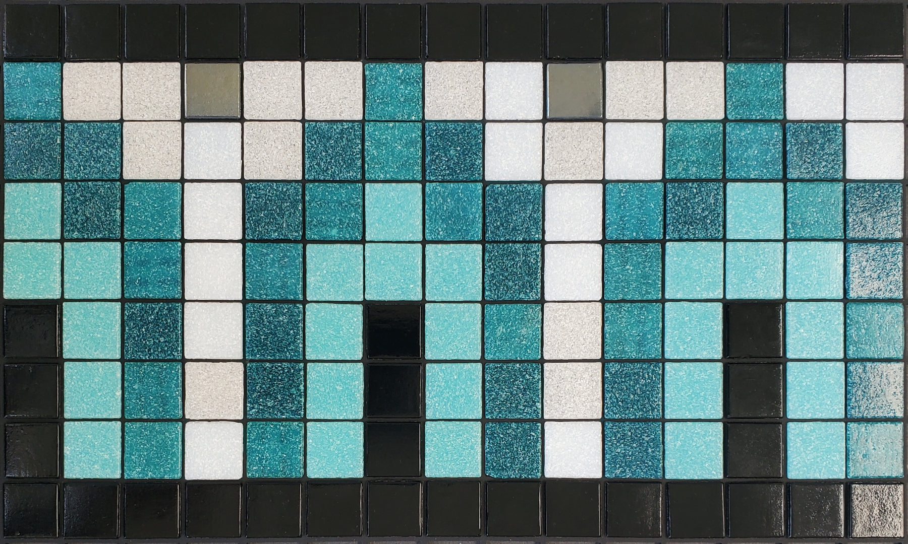 Marrakech AD - Moroccan-inspired glass mosaic waterline pool border tile - glossy black, teal, light blue and white archways with metallic silver dot accents.