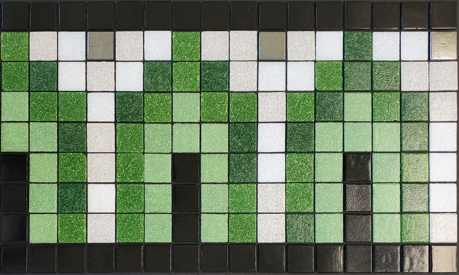 Marrakech AH - Moroccan-inspired glass mosaic waterline pool border tile - glossy black, green, white archways with metallic silver dot accents.