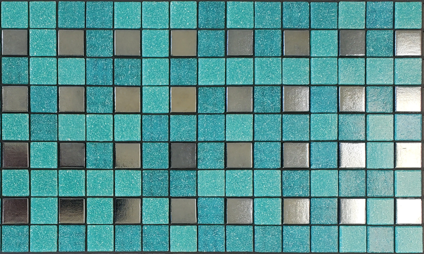 Parker B - modernism-inspired checkerboard glass mosaic waterline pool border tile - teal and metallic silver tiles in a punctuated grid.