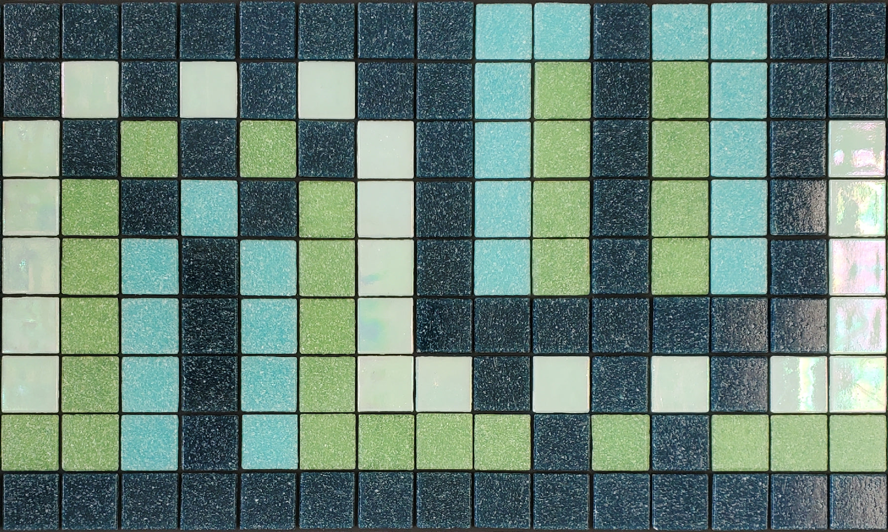 Peche Q - art deco-inspired glass mosaic waterline pool border tile - navy, aqua, light green and iridescent white tiles dance in a flowing S-curve.
