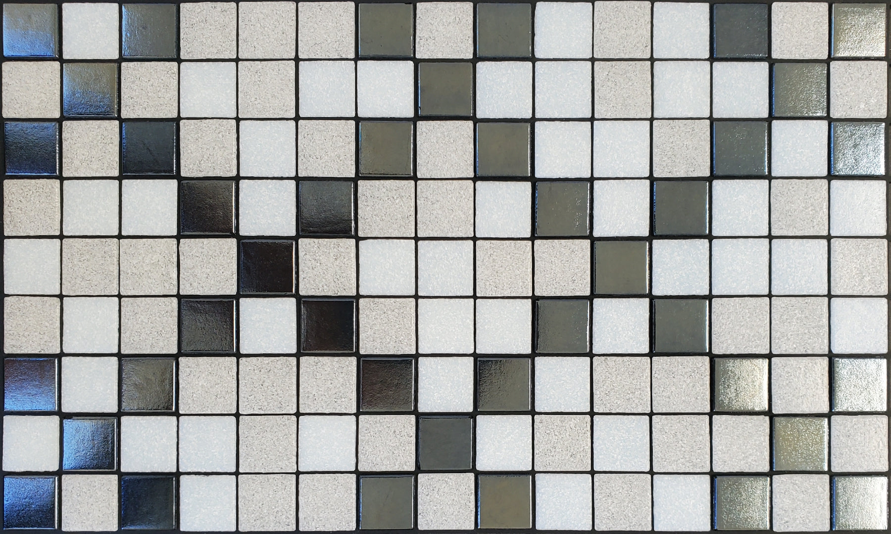 Souk K - Moroccan-inspired glass mosaic waterline pool border tile - white and metallic silver tiles in an "x" pattern.