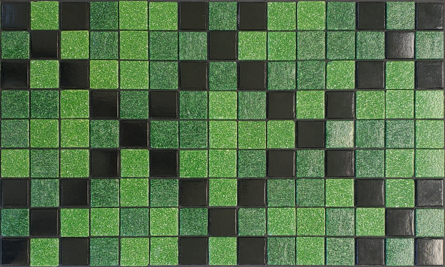 Souk Y - classic, Moroccan-inspired glass mosaic waterline pool border tile - glossy black and green tiles in an "x" pattern.